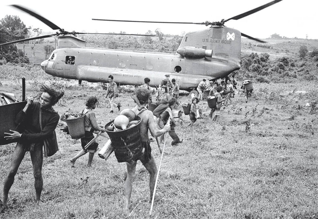 In September 1968, U.S. Army helicopters transported members of the Montagnard nation to a refugee camp during the Vietnam War. Many Montagnards later settled in North Carolina. photograph by ASSOCIATED PRESS/HENRI HUET