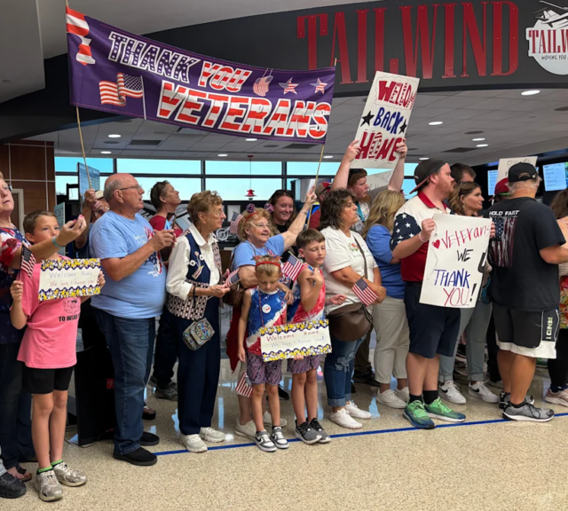 Springfield-area residents form a receiving line to honor Vietnam War veterans upon their return from their Honor Flight trip to Washington, D.C., on Tuesday, July 7, 2026.