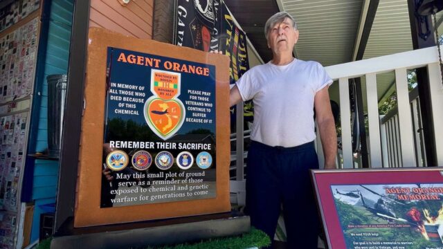 A memorial at Sunset Veterans Memorial Park to victims of Agent Orange during the Vietnam War is partially complete and should be done in a matter of weeks. The July 8, 2025, photo shows Larry Kerr, who's pushed the initiative, with a model of the memorial at his home in Syracuse. (Photo: Tim Vandenack, KSL.com)