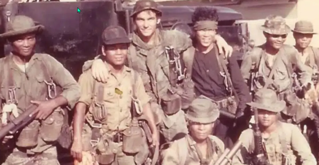 A SOG operator poses with his indigenous teammates in an undated photo. (U.S. Army) 
