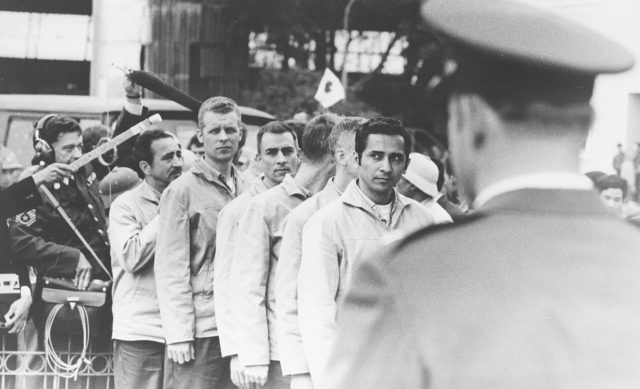 he first group of prisoners wait